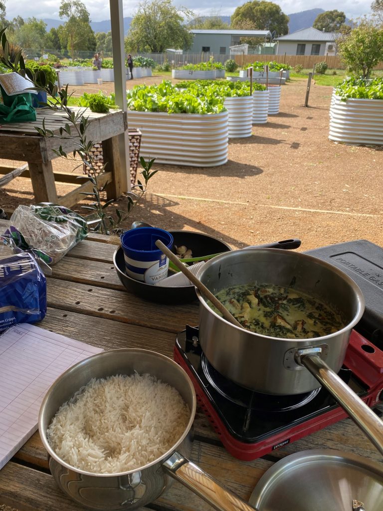Glenorchy 26Ten Community - photo of Chigwell community garden with food in saucepans