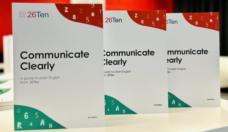 Three copies of Communicate Clearly, A guide to plain English from 26Ten.